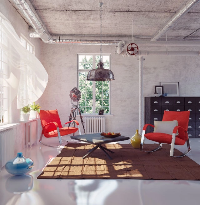 Interiér v industriálním stylu s červenými křesly a průmyslovým designem.