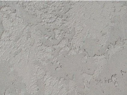 Textura betonové stěrky na vnitřní zeď s viditelnou strukturou.