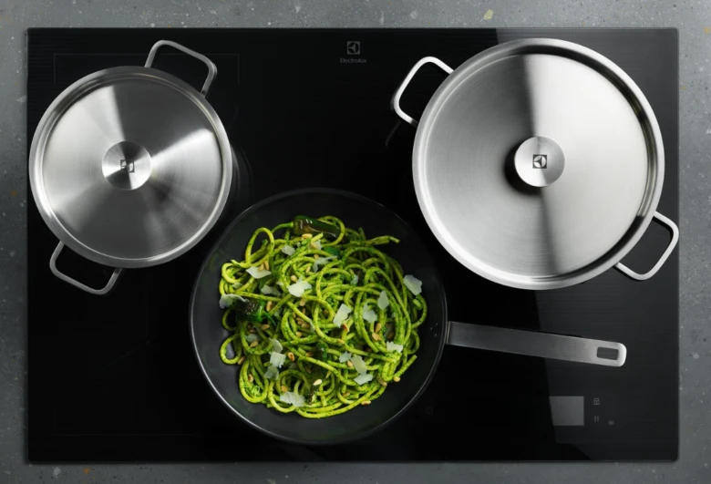 Induction cooktop with pots and pan