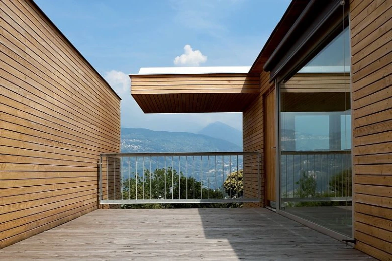 Wooden cladding facade house balcony view mountains