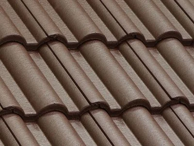 Detailní záběr na hnědé betonové střešní tašky.