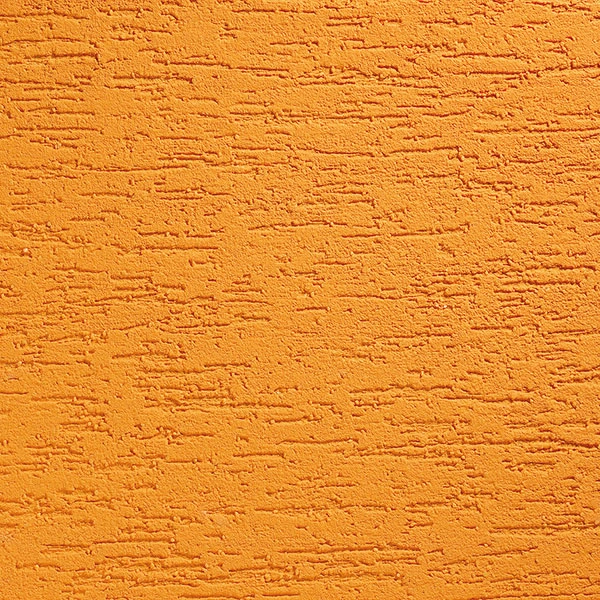 Oranžová omítka s texturou pro vnitřní zdi budov.