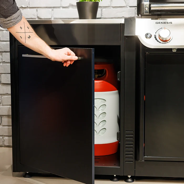 Outdoor kitchen with grill and gas tank storage